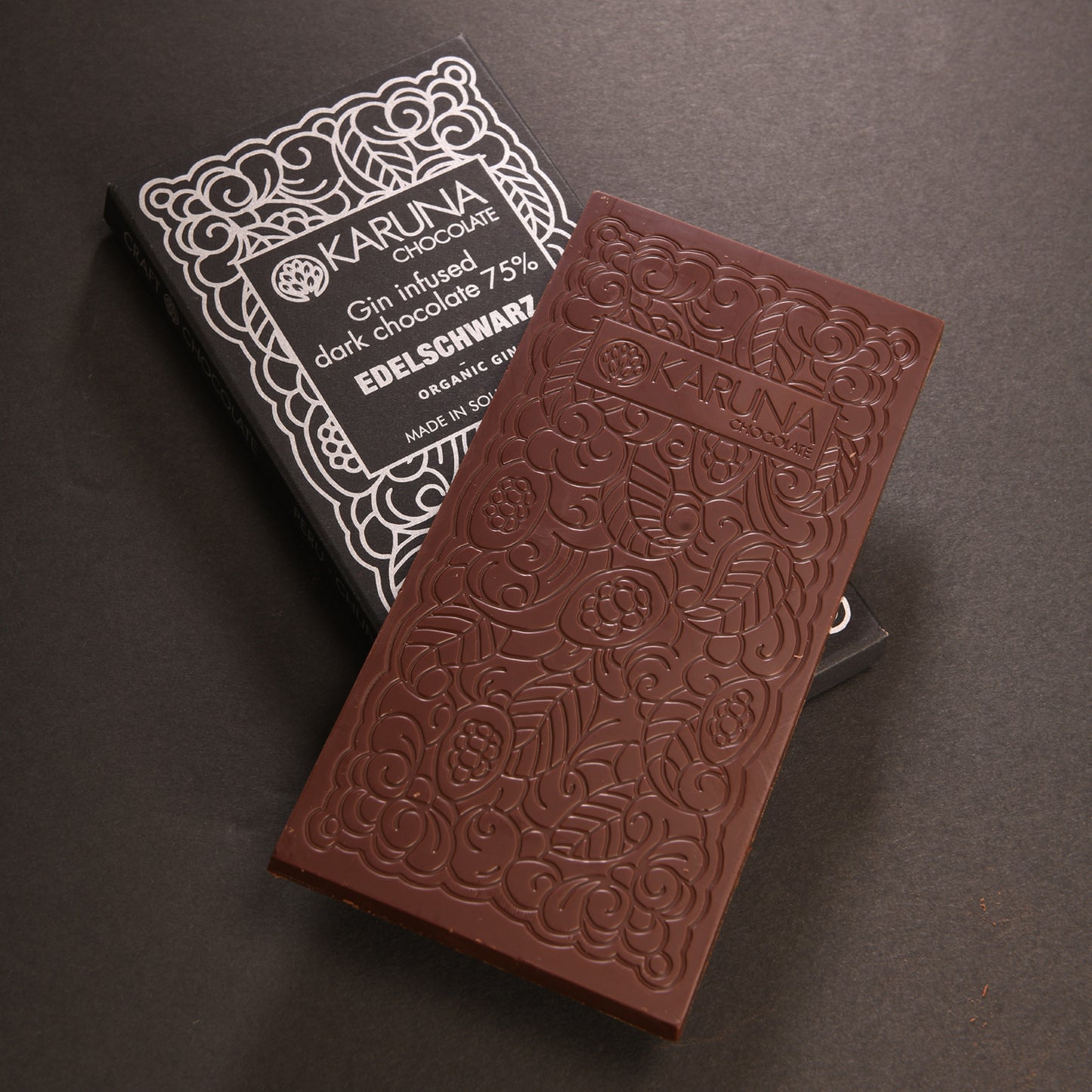 Organic gin infused dark chocolate 75% by Karuna. Vegan & organic.